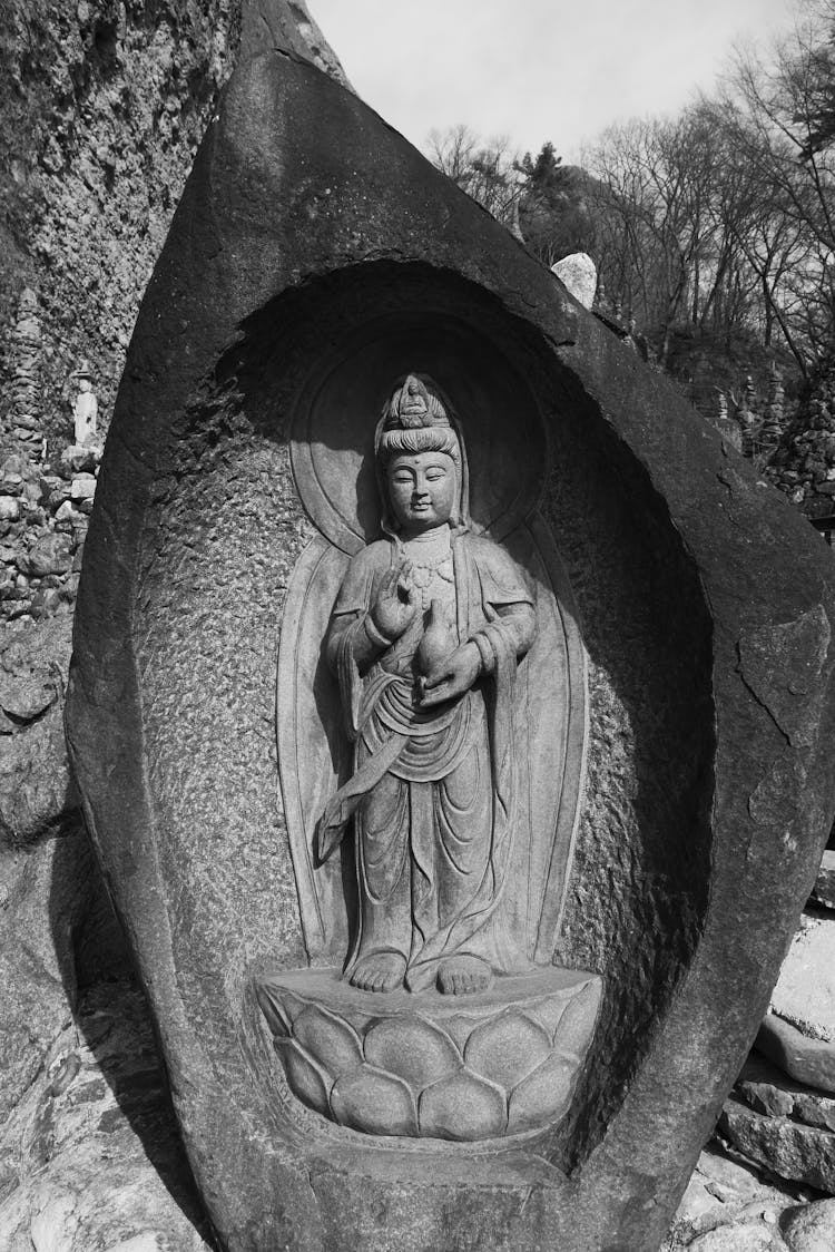 Gray Concrete Statue In A Pedestal