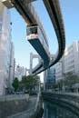 A Monorail Train Between High Rise Buildings
