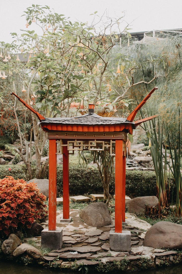 Brown And Red Wooden Gazebo In A Garden