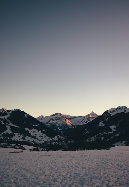 A Snow Covered Mountain Under the Clear Sky