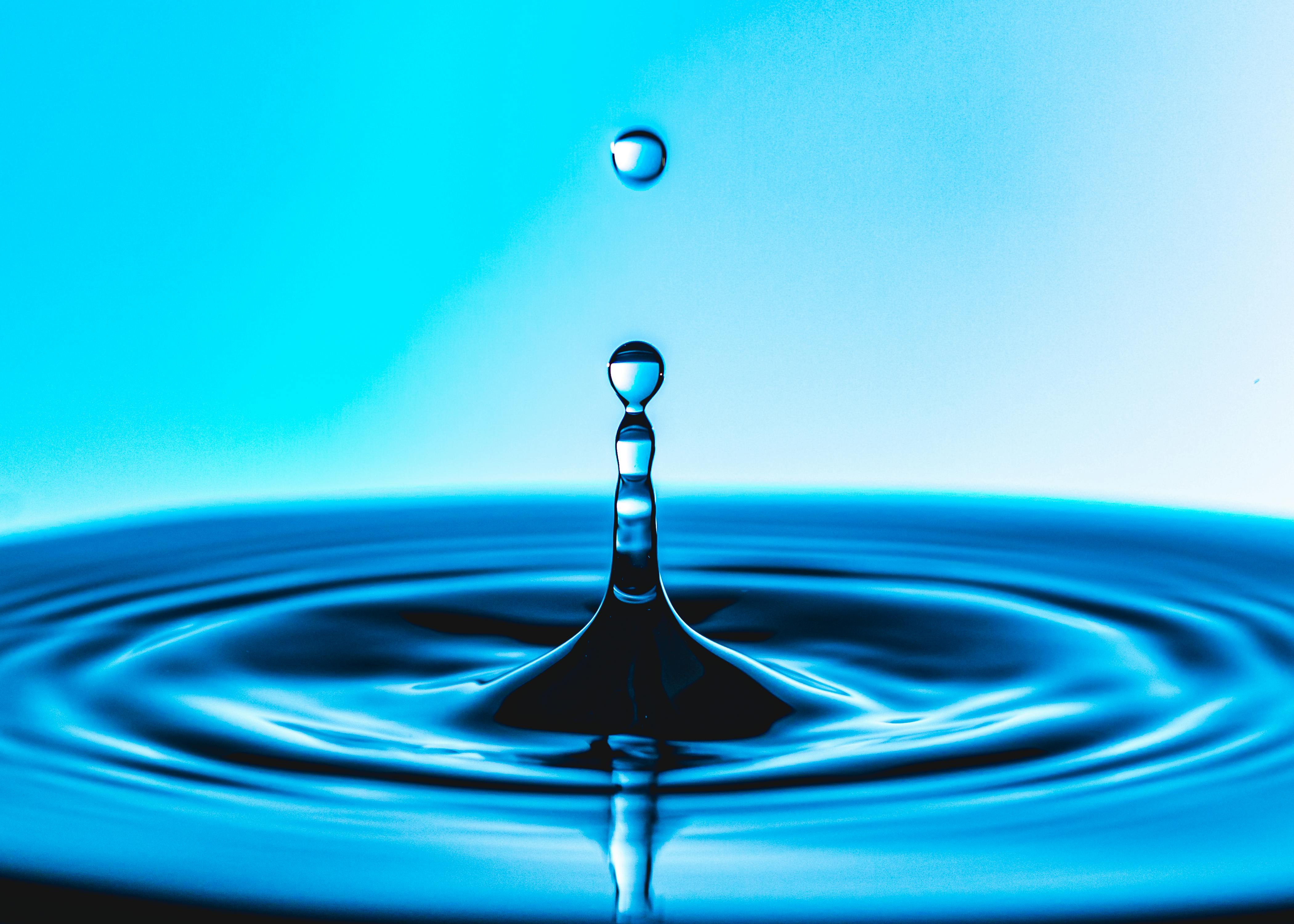 Night sky with visible moon over a calm landscape