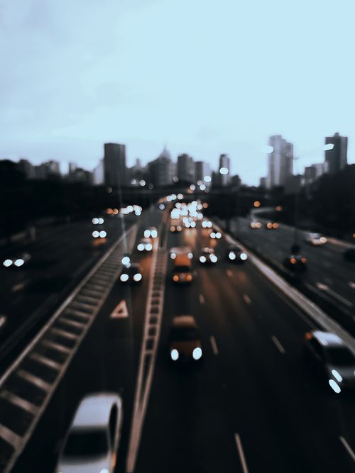 Free A blurred view of traffic on a highway in Vila Mariana, São Paulo during twilight, capturing urban movement. Stock Photo