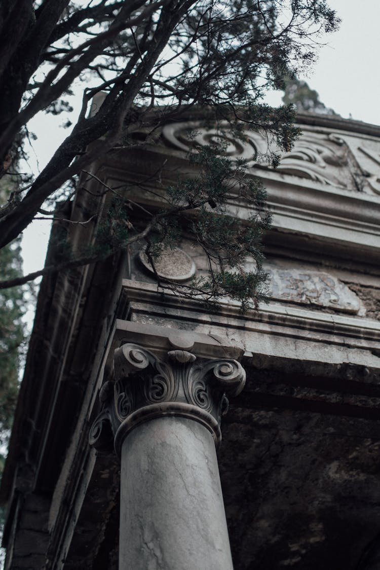 A Concrete Building With A Pillar