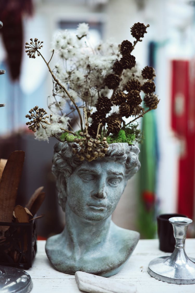 Flowers On A Head Statue Vase