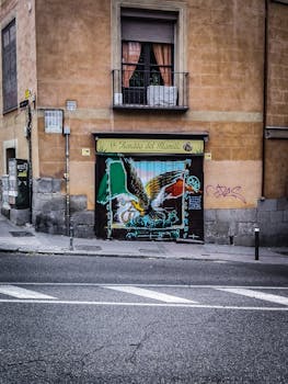 Graffiti of an eagle on a storefront in Madrid's historic district.