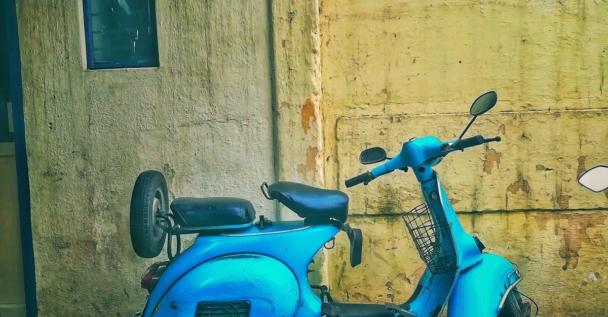 Teal Motor Scooter on Road