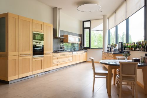 Modern kitchen with wooden cabinets and window