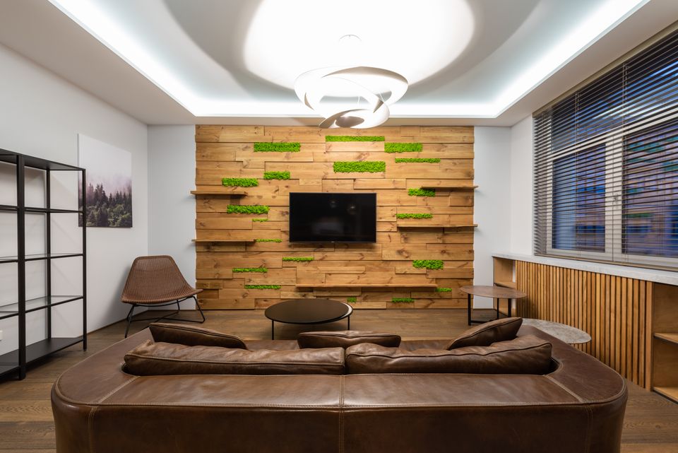 Modern lounge with a leather sofa and wall-mounted television