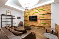 Black Flat Screen Tv on Brown Wooden Tv Rack