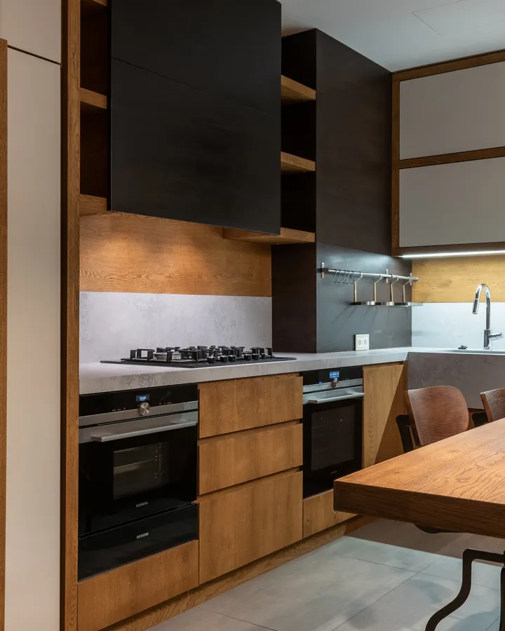 How Long Do Refrigerators Last? Lifespan, Warning Signs and When to Replace Contemporary kitchen with wooden accents and modern appliances