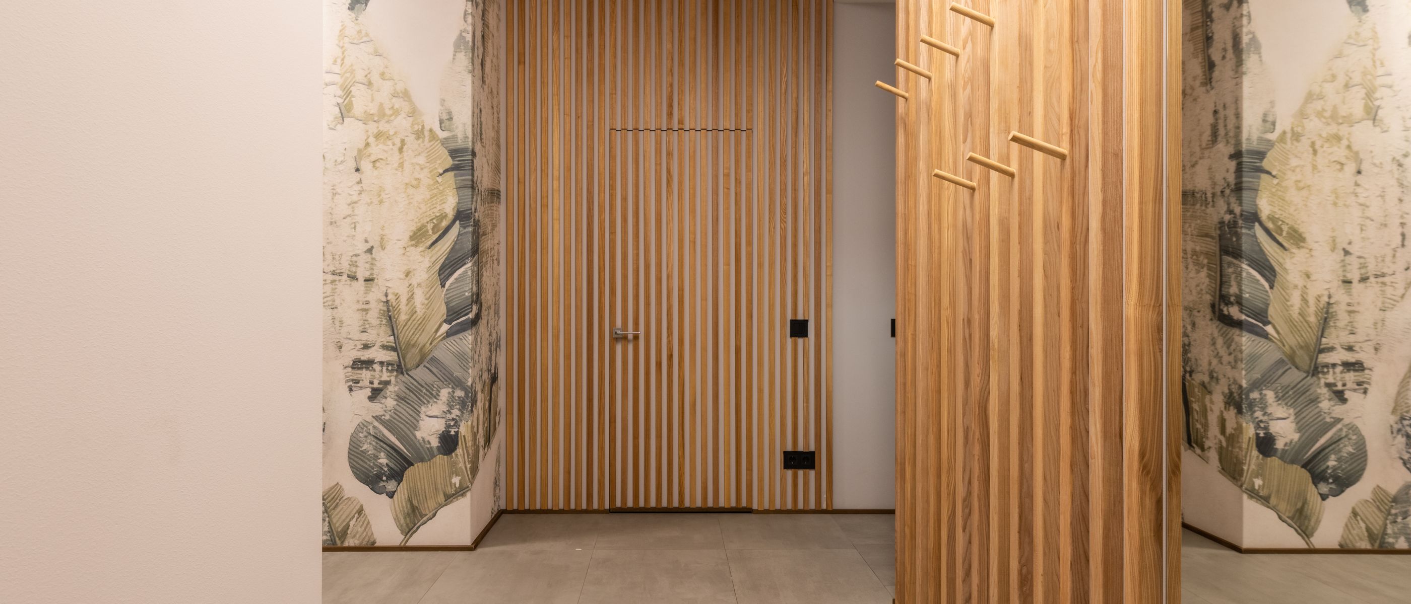Wallpapering in Tolworth — woodwork brushed to a crisp, smooth line