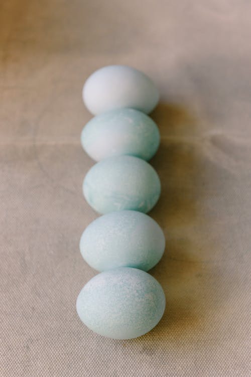 A Row of Eggs in Shades of Light Blue
