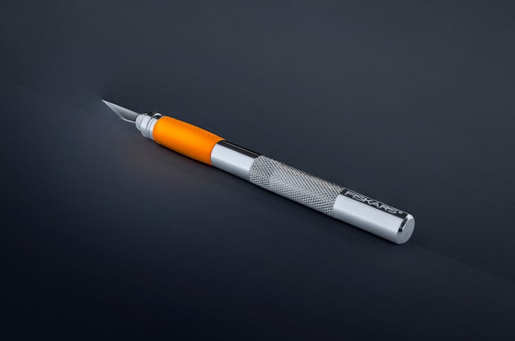 Gray And Orange Craft Knife