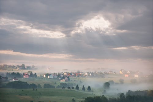 Green Grass Field during Cloudy Sky