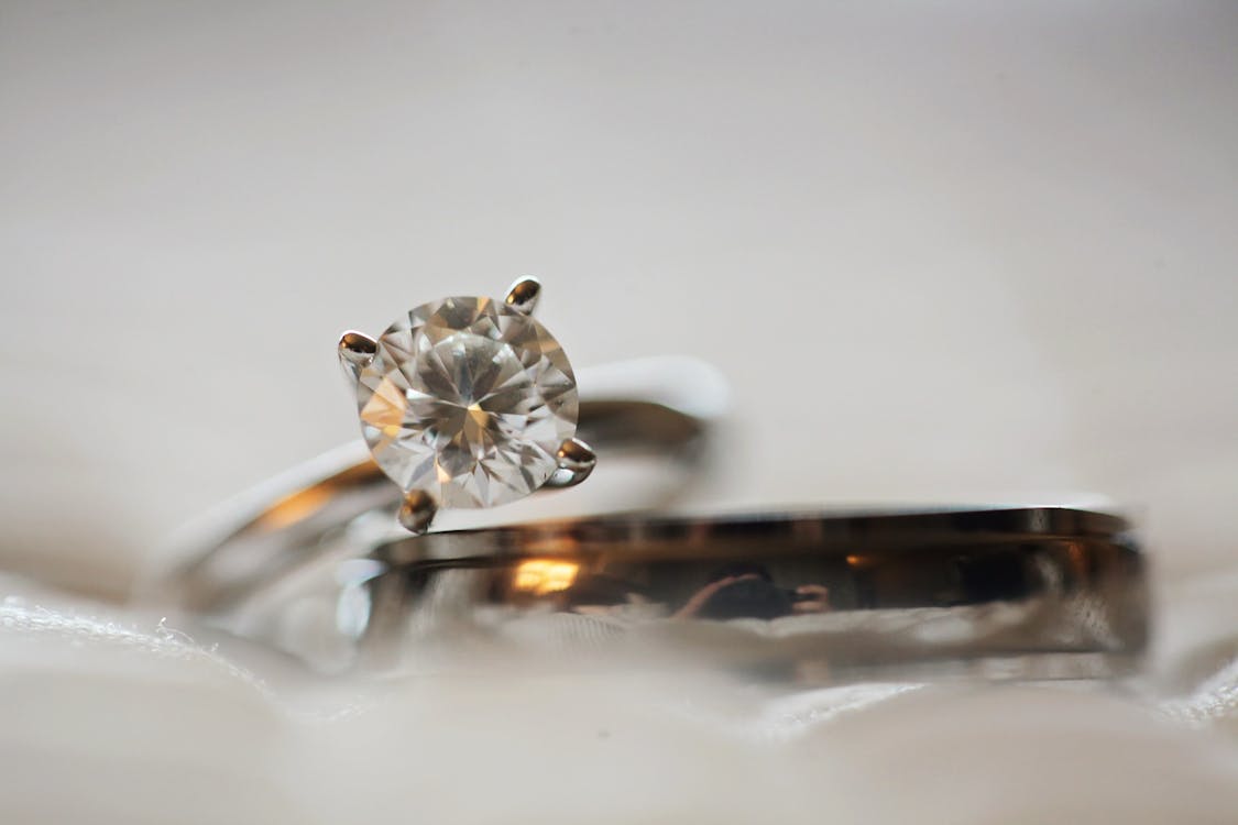  Close Up Photo of Diamond Stud Silver-colored Eternity Ring