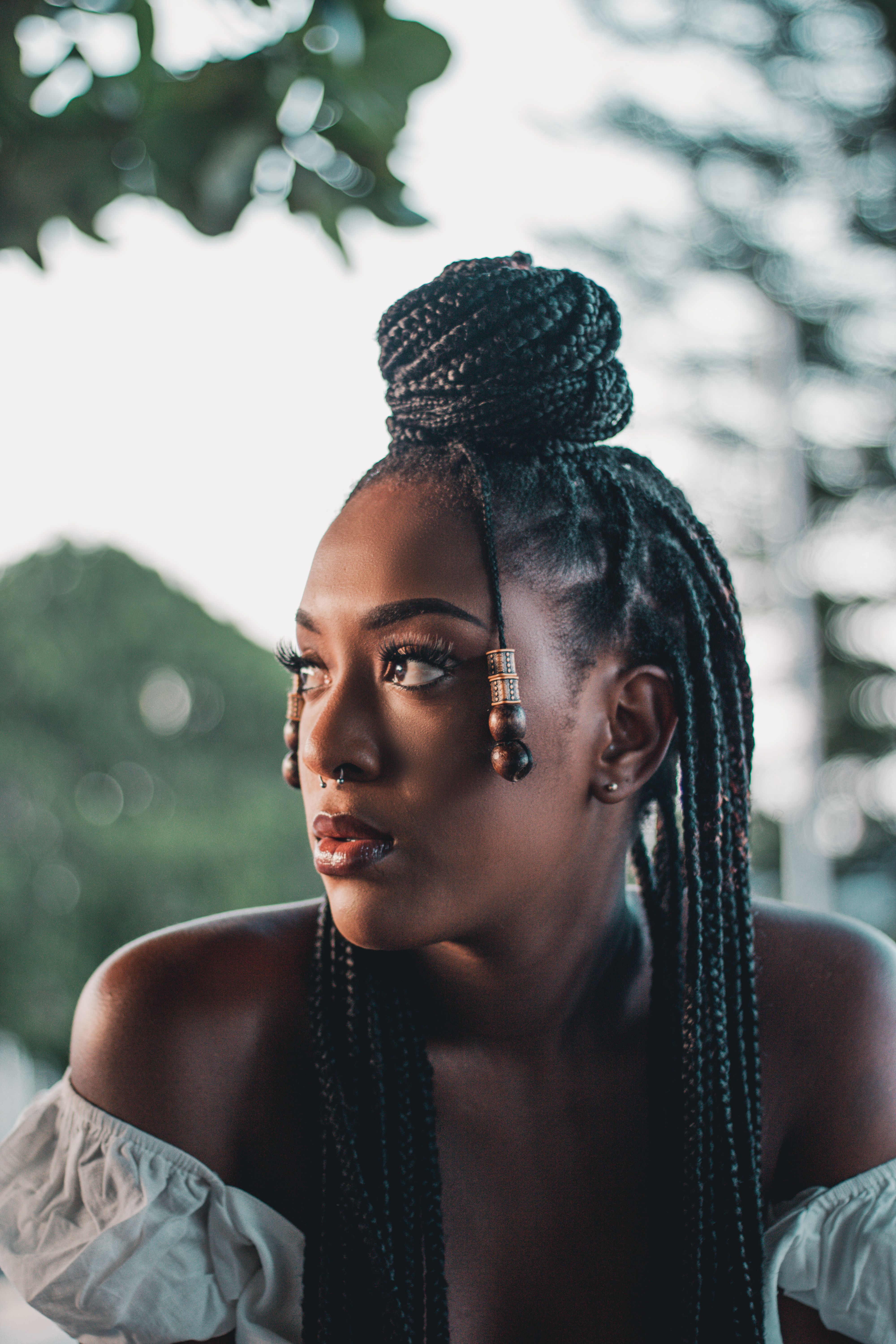 Portrait of a Young Woman with Braided Hair · Free Stock Photo
