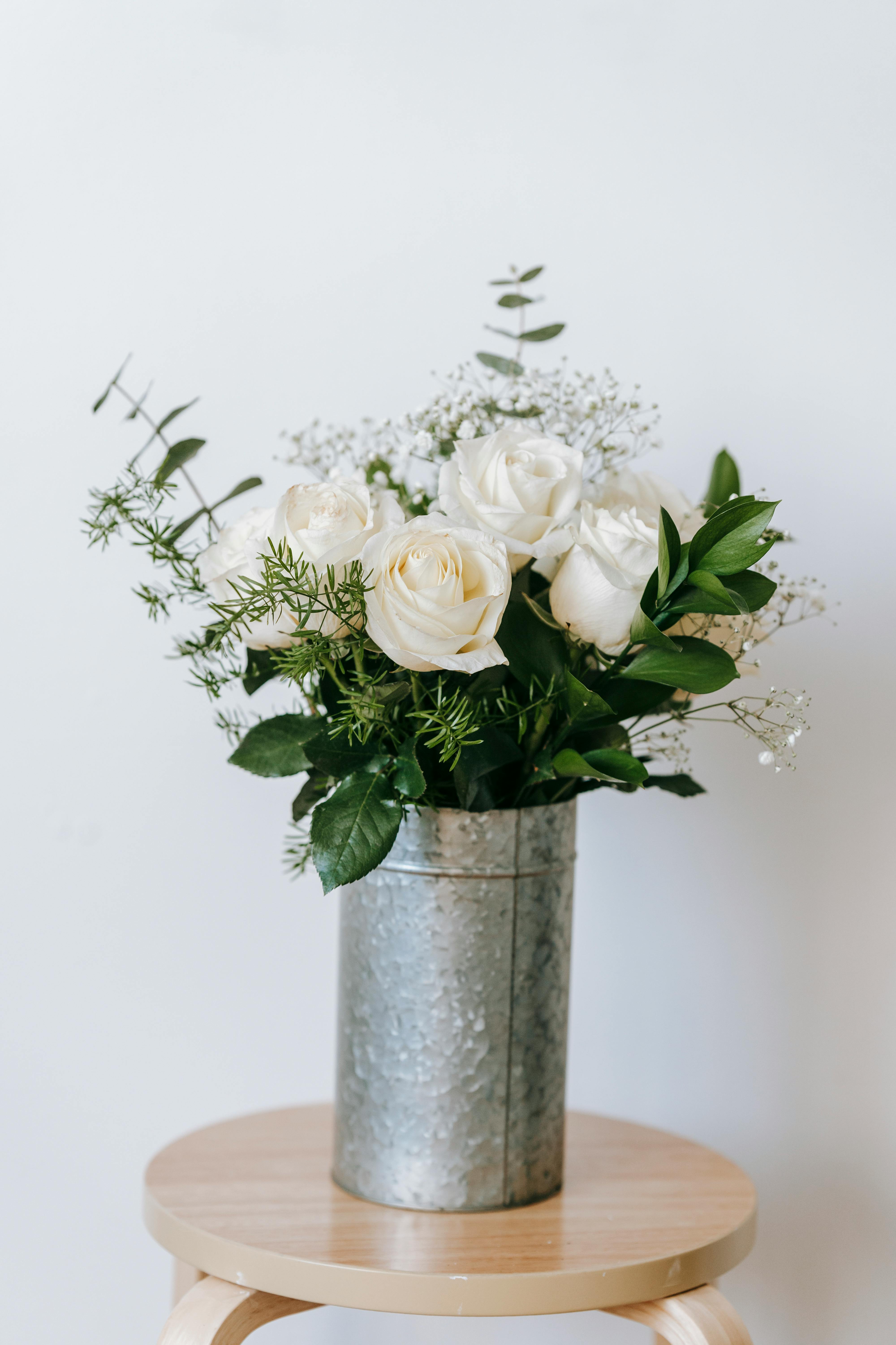 bouquet of flowers placed against light wall