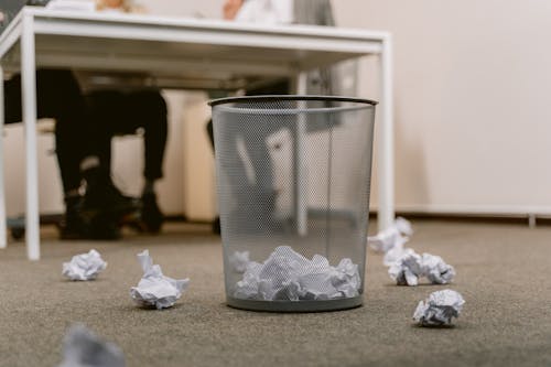 Free Crumpled Papers Inside the Trash Bin at the Office Stock Photo