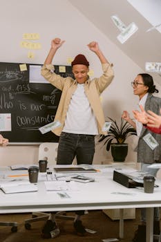 A lively office scene with diverse team members celebrating and brainstorming ideas.