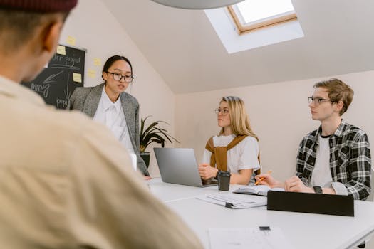Professional team engaged in a creative meeting in a modern office setting.