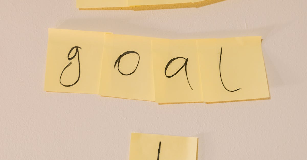 Sticky notes with the text 'our goal' on a wall emphasizing objectives.