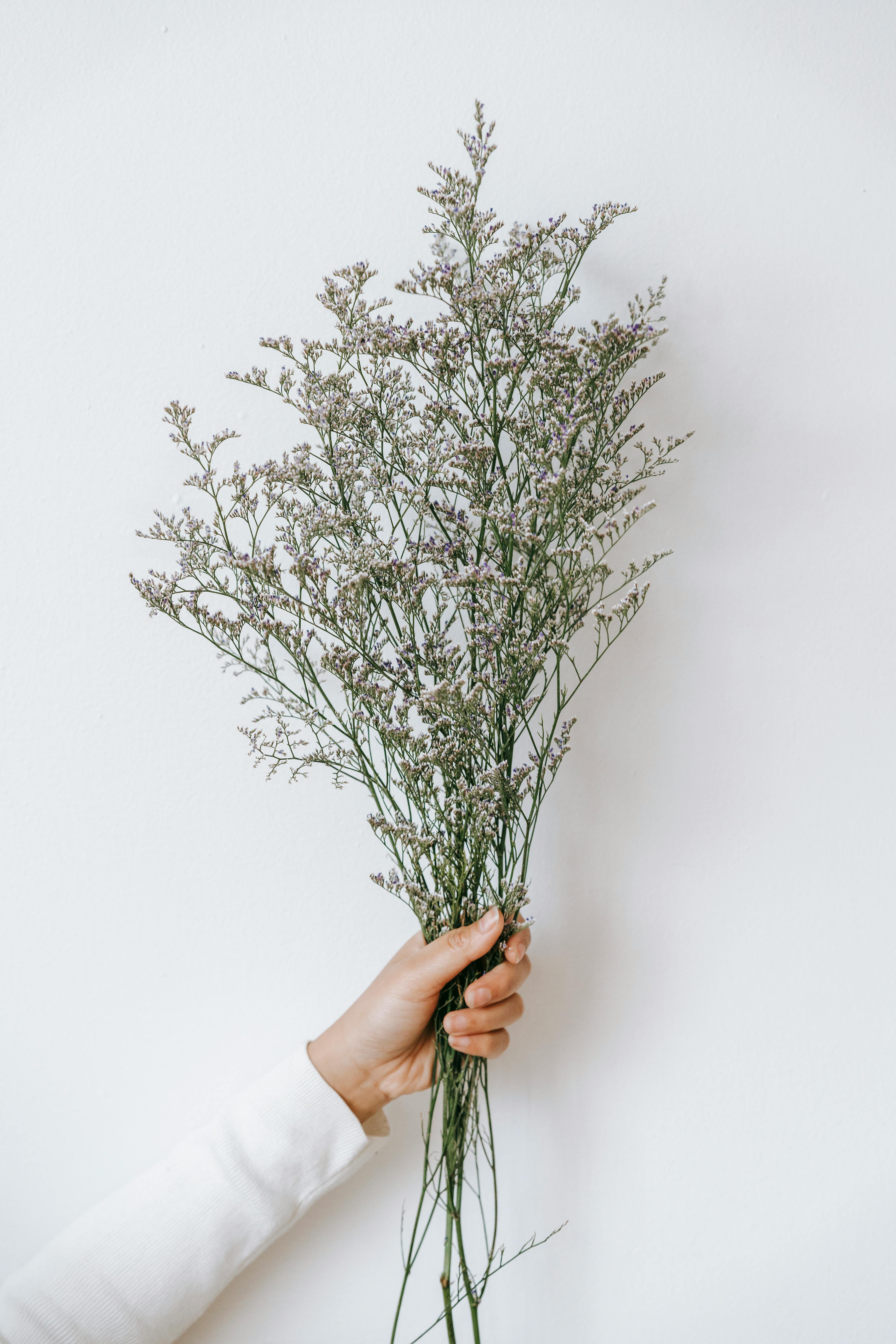 woman with bunch of flowers in studio