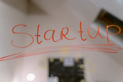 Conceptual image of startup text written on a mirror, symbolizing innovation and new beginnings.
