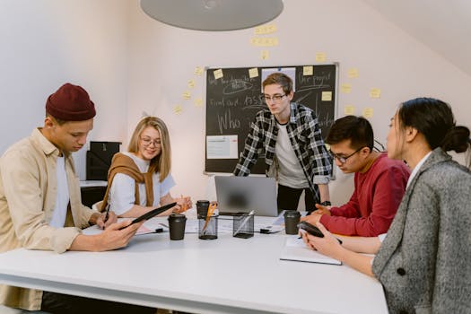 Diverse team discussing ideas in a modern office setting, focusing on teamwork and collaboration.
