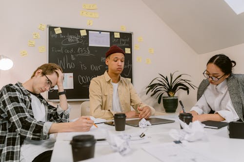 People Sitting at Table Planning a Business