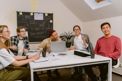 People Laughing While in a Meeting