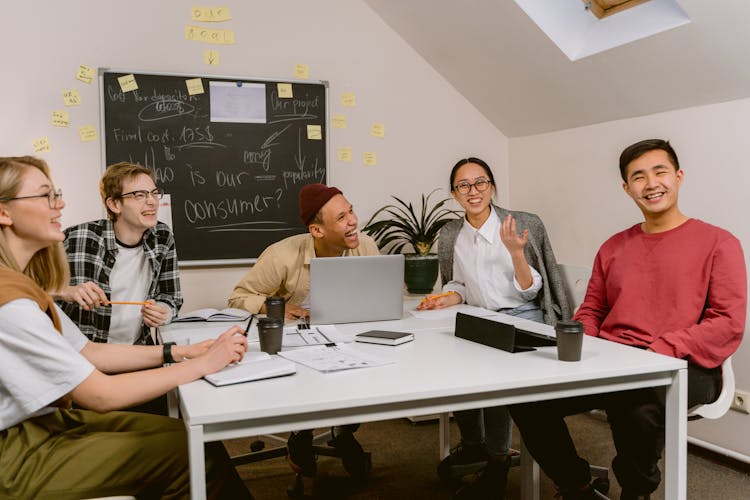 People Laughing While In A Meeting