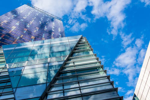 Glass Building Panels Under Blue Sky