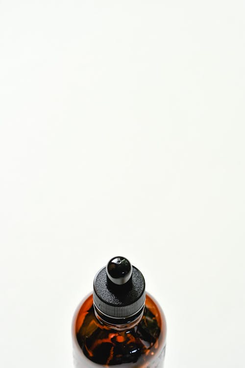Free Close-Up Shot of a Bottle of Essential Oil Stock Photo
