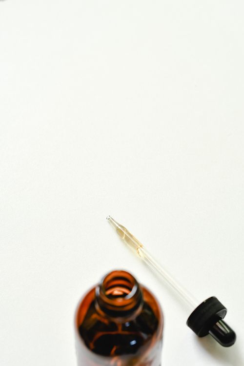 Free Simple and elegant image of a dropper bottle with copy space on a white background. Stock Photo