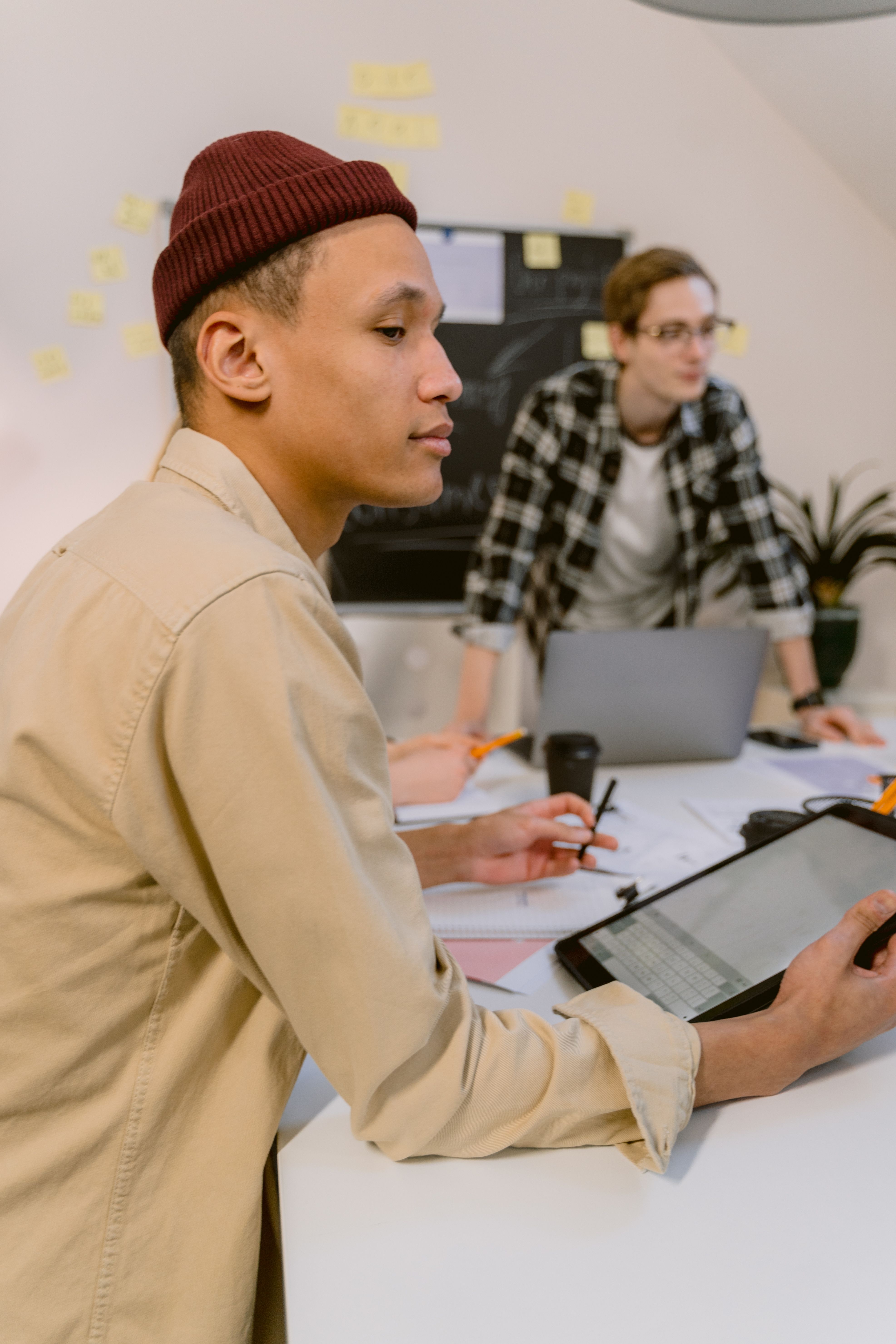 Colleagues reviewing a project on a tablet