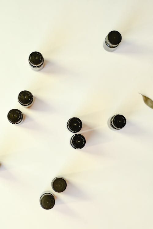Free Small Bottles on a White Surface Stock Photo