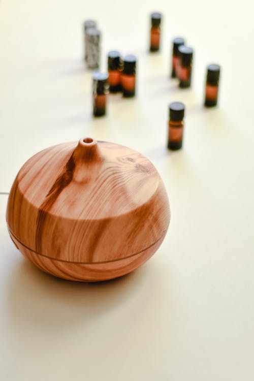 Free Wooden Oil Diffuser on White Surface Stock Photo