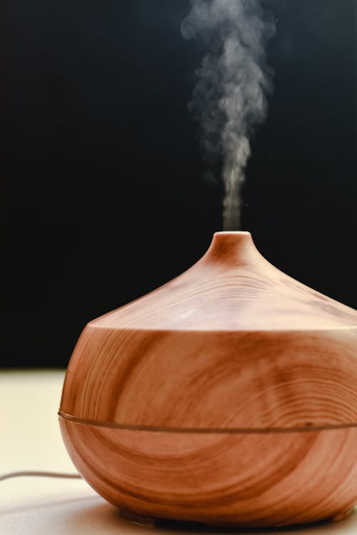 Free Brown Wooden Diffuser with Smoke Stock Photo