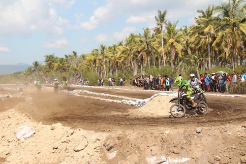 People Riding Motorcycles on Dirt Race Track