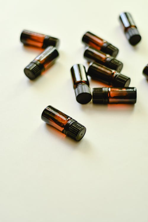 Small Bottles on White Surface