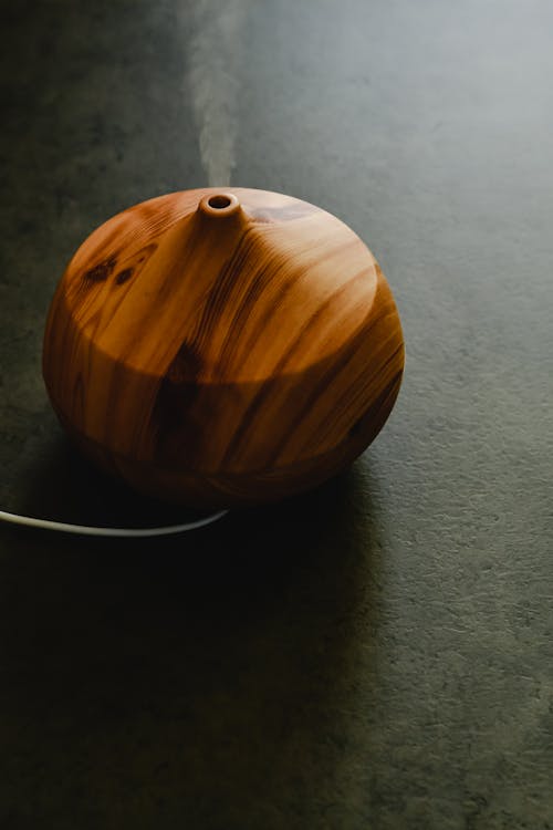 Brown Wooden Round Table on Gray Surface