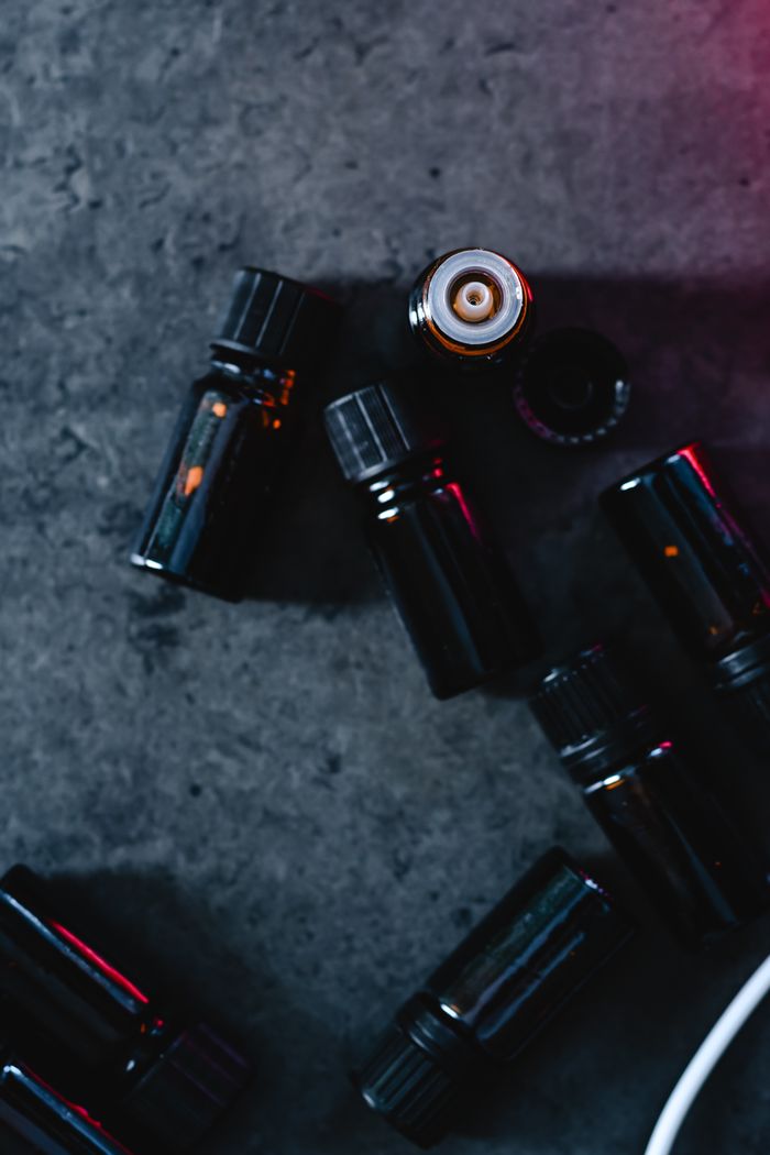 Dark glass bottles on concrete surface