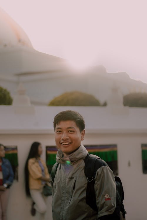 Shallow Focus of a Man Carrying His Backpack