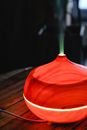 Red Ceramic Bowl With Green Straw