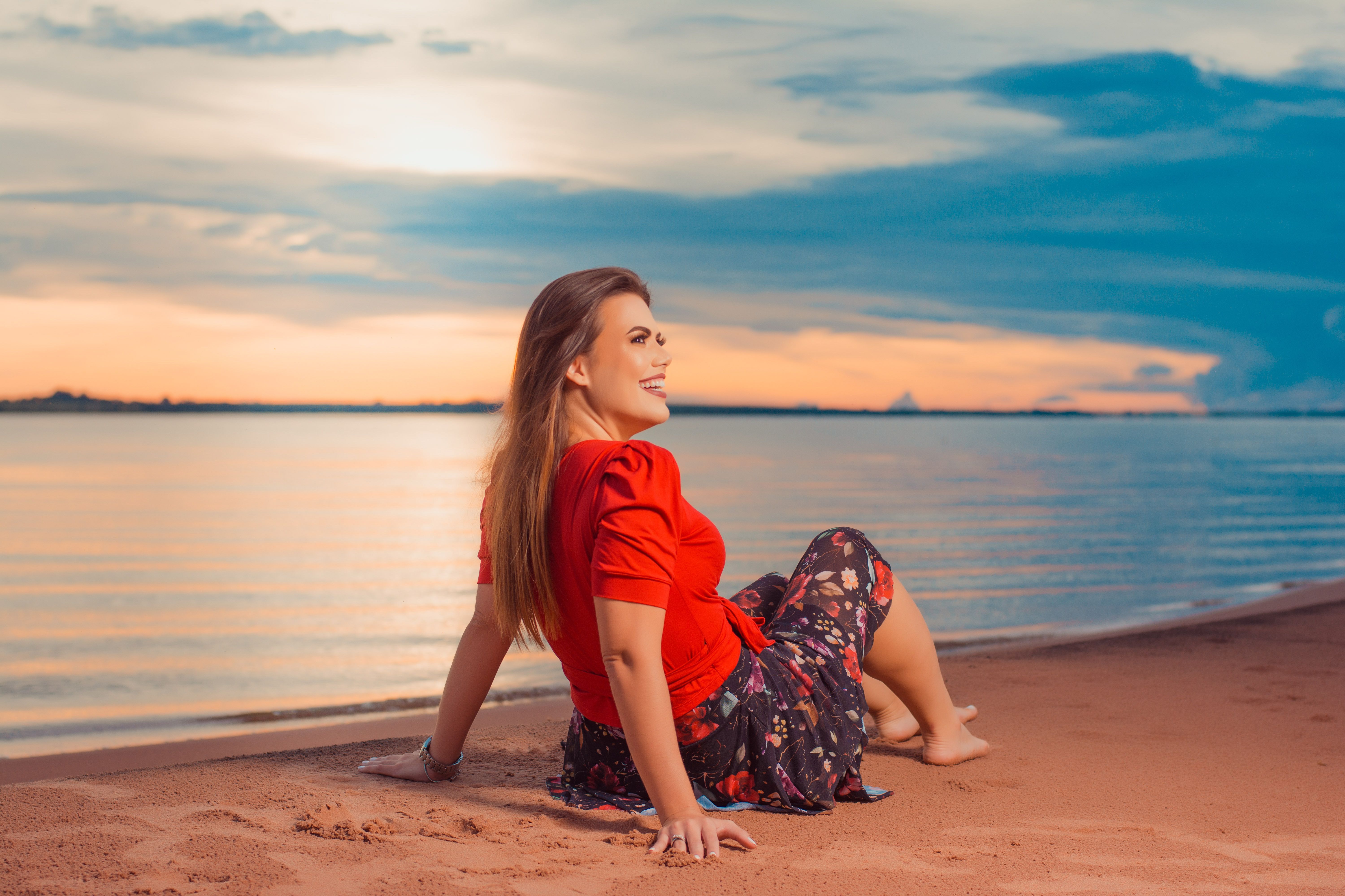 A Woman in Red Shirt Sitting on the Beach · Free Stock Photo