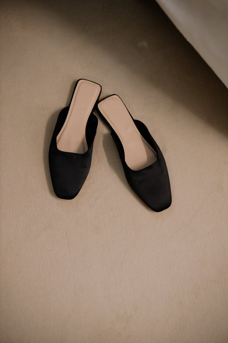 A Pair Of Slip-On Flats On The Floor