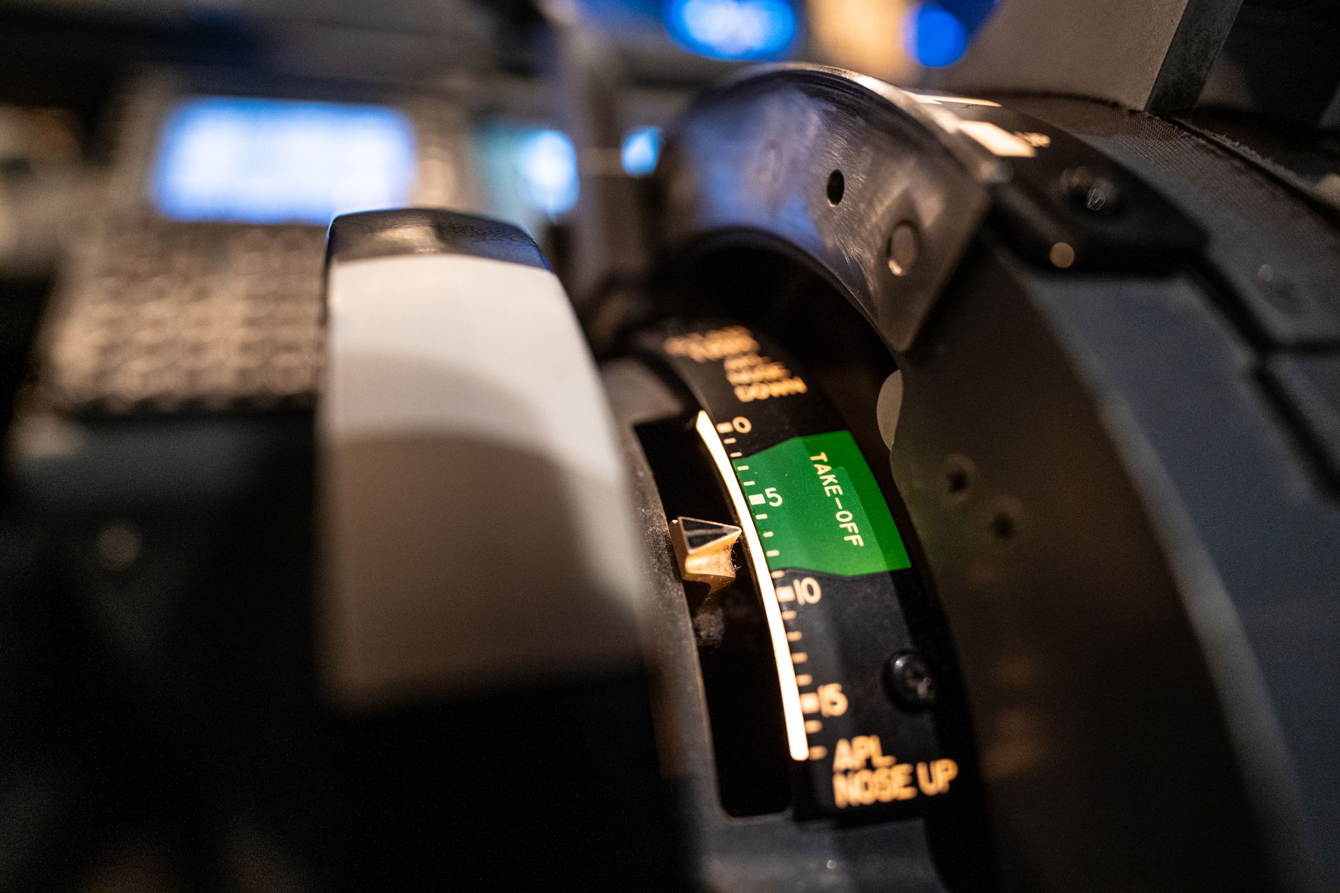 Detailed view of an aircraft throttle control panel in a cockpit, showcasing aviation technology.
