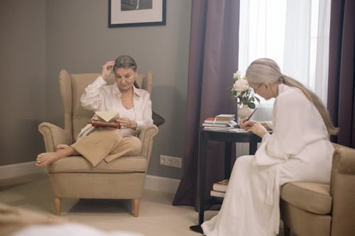 Elderly Women Sitting on Sofa Chair