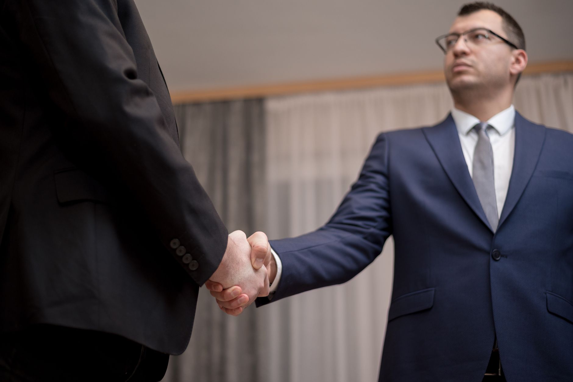 Contact Enrichment Tools: The Complete 2026 Guide 3 Warm introduction facilitated beyond contact enrichment tools, showing two executives meeting through AI-matched introduction