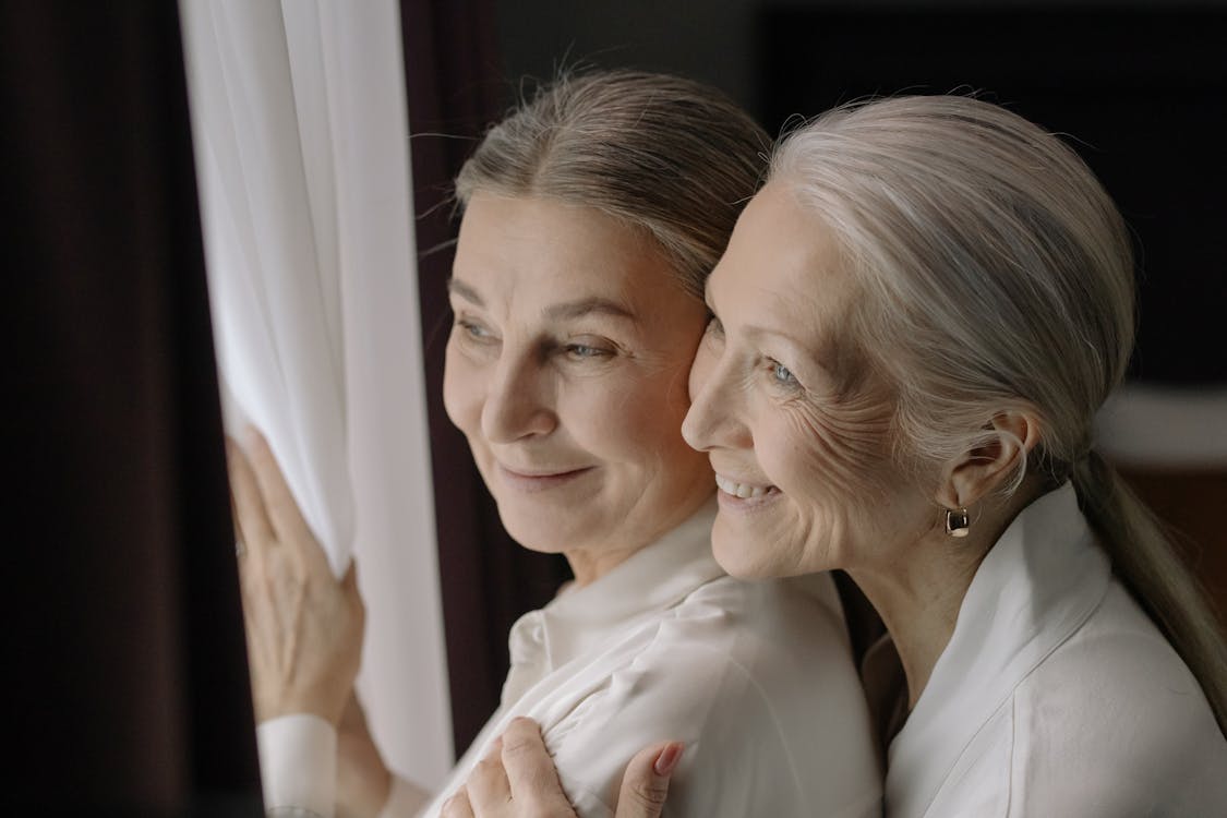 Free Elderly Women Looking Outside Together Stock Photo
